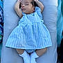 baby, sleeping, infant, dress, blue_stripes, white_socks, cushion, blanket, soft, peaceful, face, arms_up, indoors, resting, cute, newborn, child, person, portrait, calm