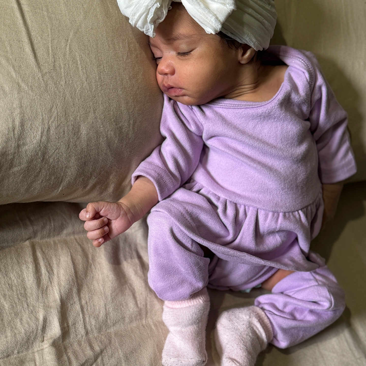 Rap joined the competition — help win amazing prizes! baby, bed, bow, child, clothing, couch, footwear, hand, headband, indoors, infant, peaceful, pillow, portrait, purple_outfit, rest, skin, sleeping, socks, soft_fabric