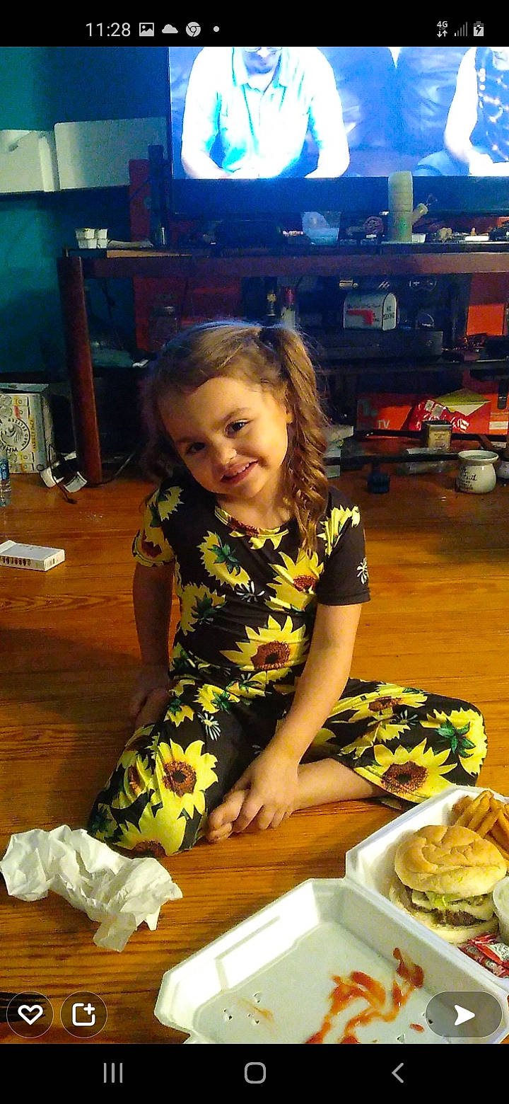 Kenleigh is registered to the contest to win money with this photo: chair, comfort_food, cooking, cuisine, dish, finger_food, flooring, food, food_craving, fun, ingredient, joy, junk_food, person, plate, recipe, sandwich, smile, t_shirt, table