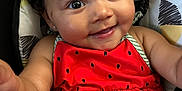 Victoria joined the competition — help win amazing prizes! arm, baby, baby_girl, child, clothing, curly_hair, cushion, cute, eyes, face, happy, indoor, infant, person, portrait, red_dress, seat, skin, smiling, watermelon_pattern