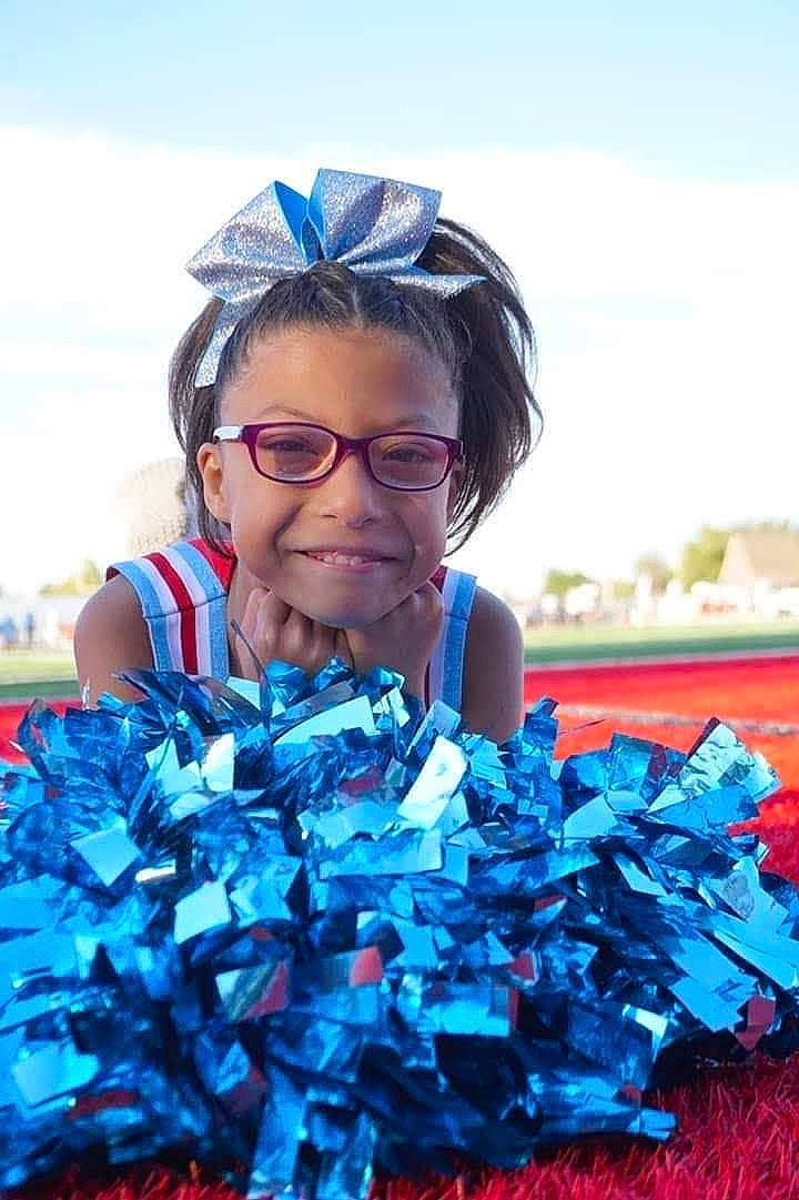 Reina is registered to the contest to win money with this photo: blue, cheerleading, cobalt_blue, electric_blue, joy, person, pom_pom, recycling