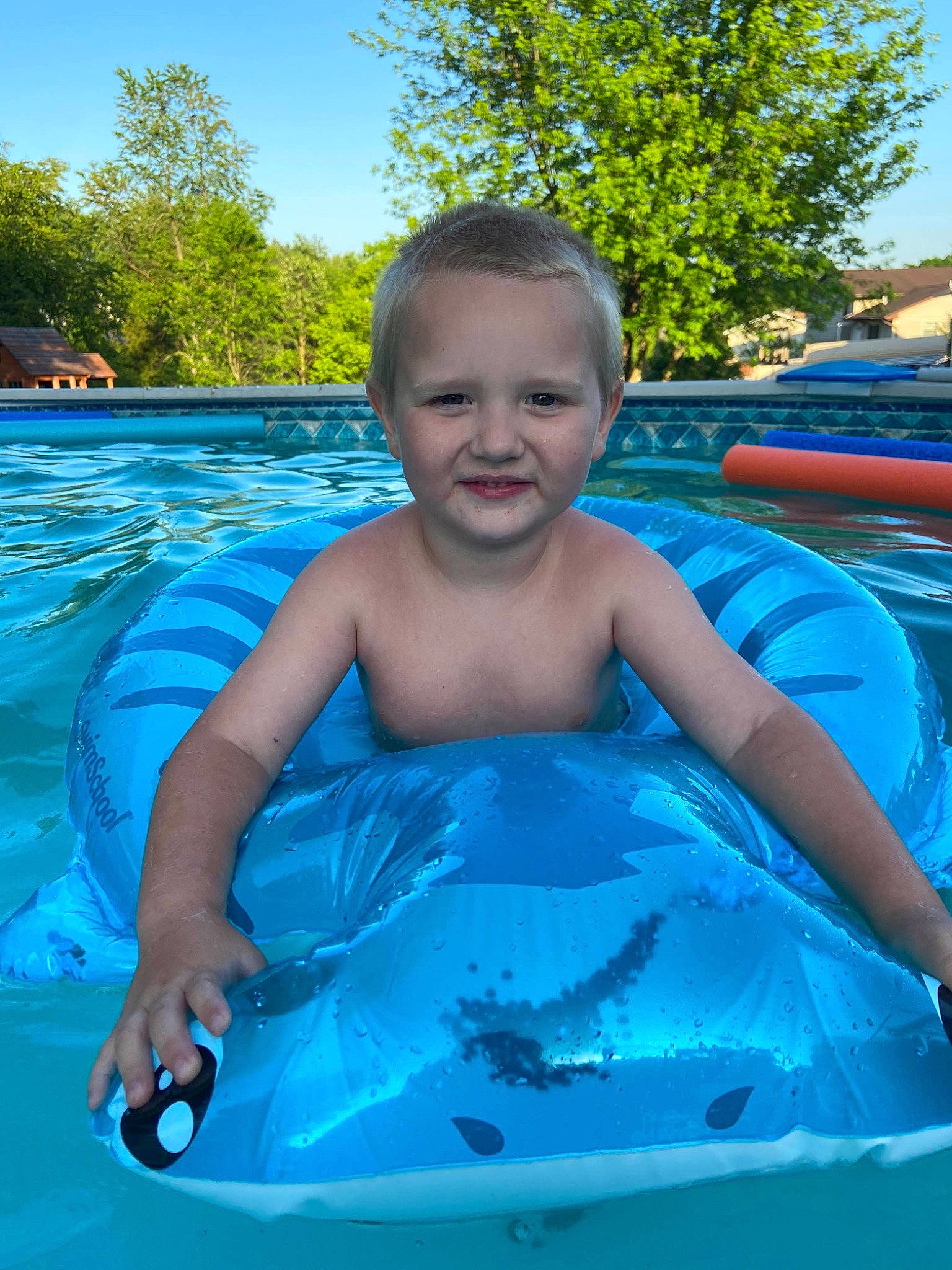 Conor is registered to the contest to win money with this photo: child, fun, games, inflatable, leisure, person, recreation, smile, summer, swimming_pool, vacation, water, water_park