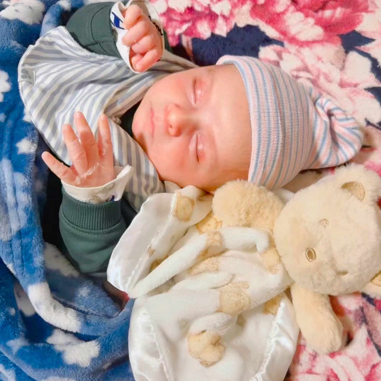 Ahad joined the competition — help win amazing prizes! baby, blanket, blue, clothing, cozy, cute, face, floral_pattern, hand, hat, infant, newborn, peaceful, pink, portrait, resting, sleeping, soft_toy, striped, teddy_bear