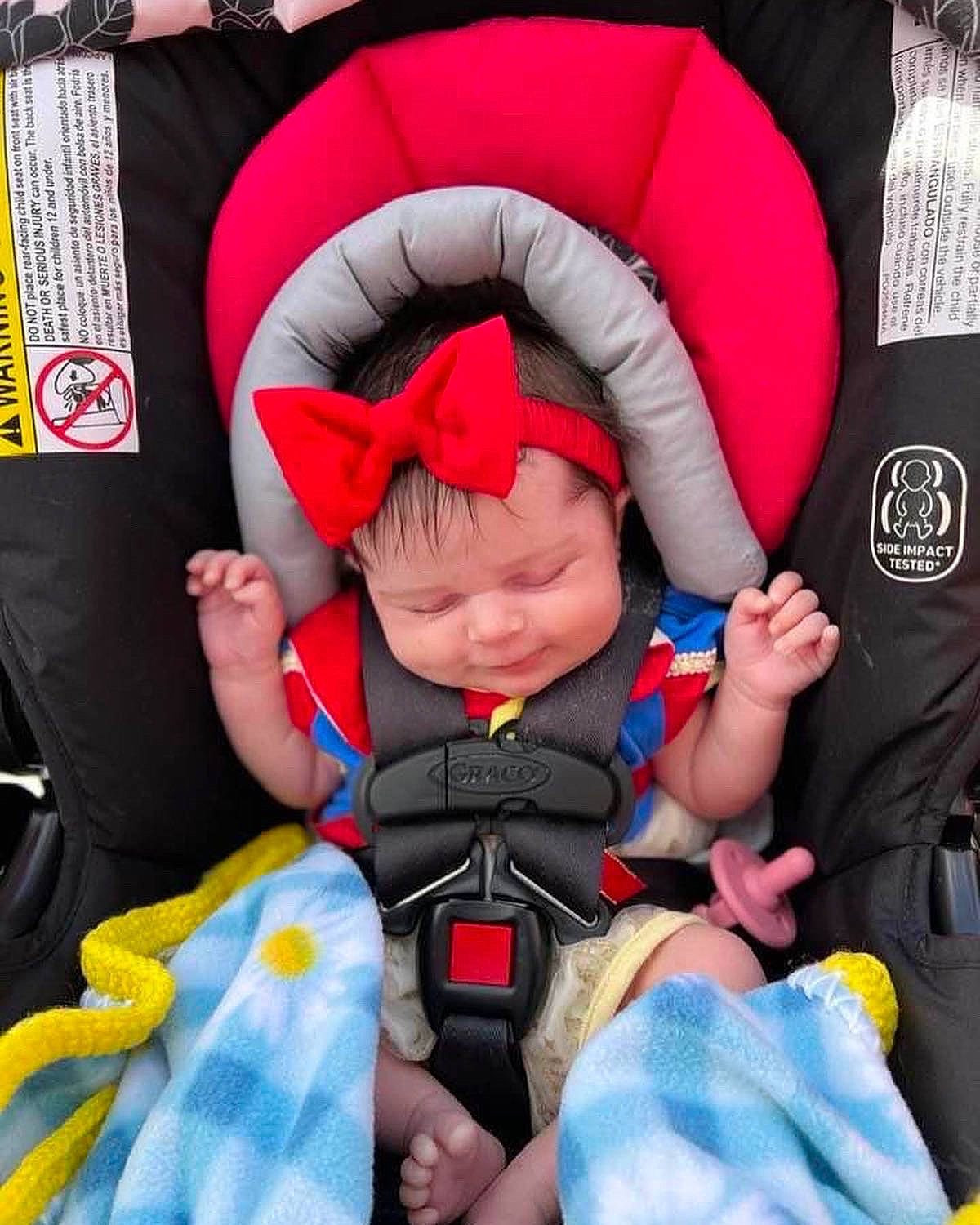 Hannah joined the competition — help win amazing prizes! baby, baby_carriage, baby_in_car_seat, baby_products, baby_sleeping, baby_toddler_clothing, car_seat, child, comfort, electric_blue, fun, gesture, headwear, lap, person, personal_protective_equipment, red, seat_belt, stuffed_toy, textile