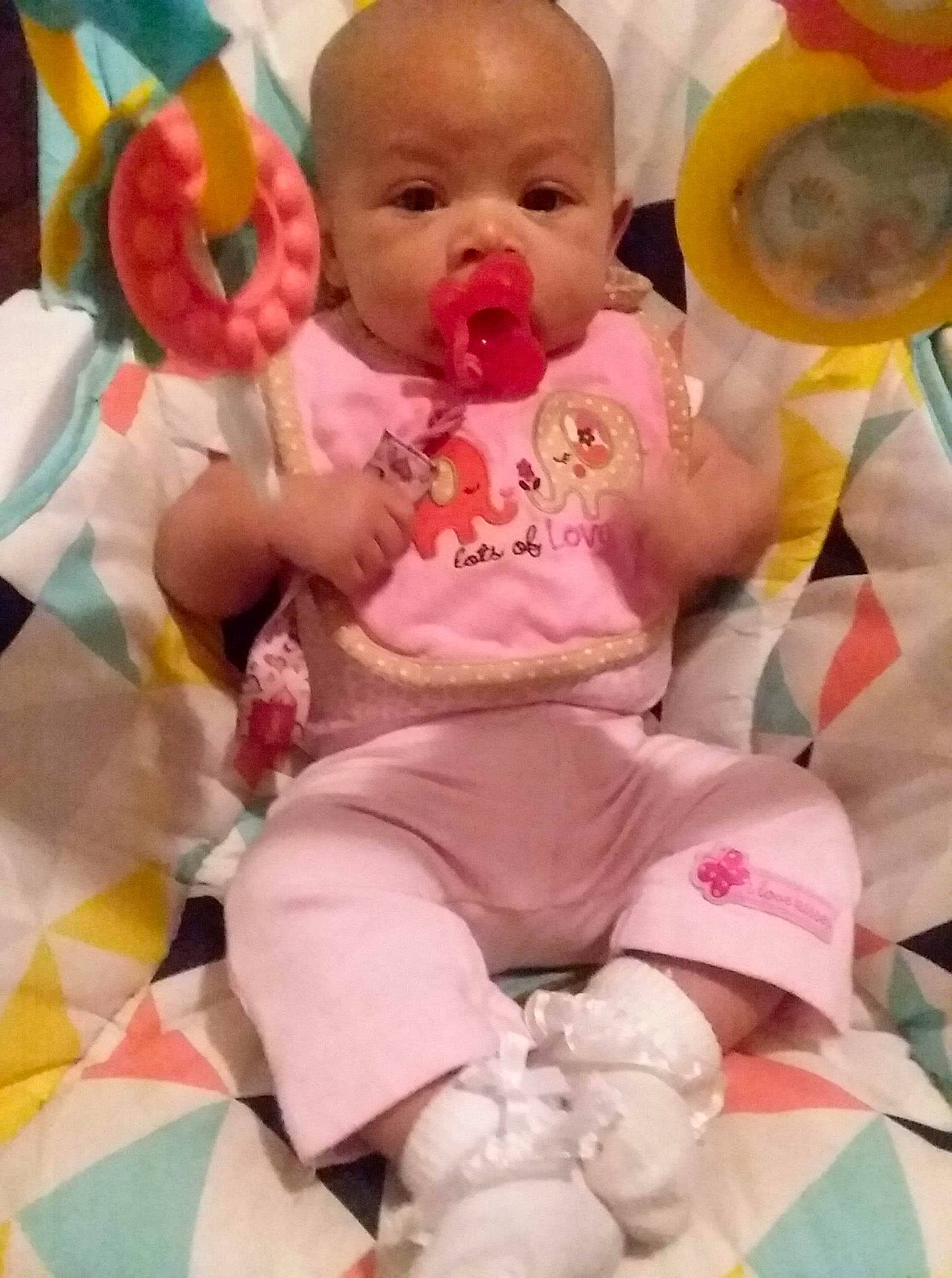 Miami is registered to the contest to win money with this photo: baby, baby_products, baby_toddler_clothing, bib, cheek, child, fun, happy, linens, magenta, pattern, person, pink, play, product, sitting, skin, sleeve, sock, toddler