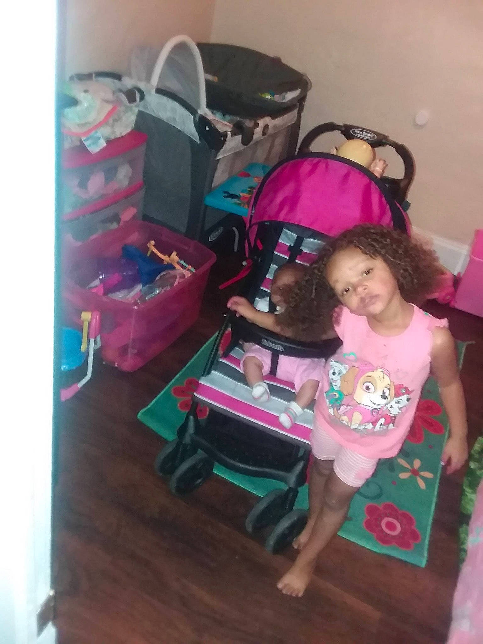 Jada is registered to the contest to win money with this photo: beauty, child, comfort, event, eyewear, flooring, fun, happy, hardwood, lap, leisure, magenta, person, pink, purple, room, sandal, sitting, t_shirt, toddler