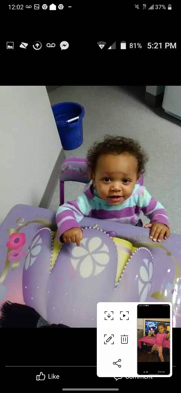 Jada is registered to the contest to win money with this photo: baby, baby_carriage, baby_products, baby_safety, baby_toddler_clothing, child, eyelash, fun, gadget, material_property, person, photo_caption, photograph, pink, play, purple, room, sitting, snapshot, toddler