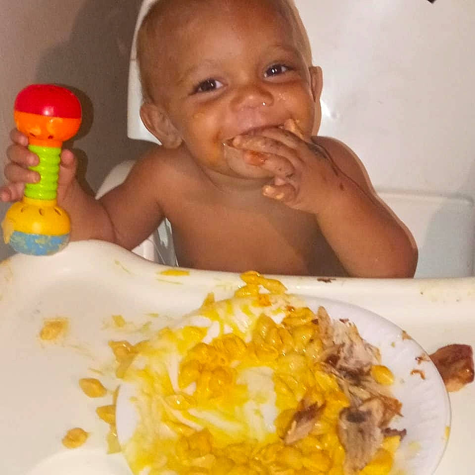 Juelz is registered to the contest to win money with this photo: baby, baby_bottle, chair, child, cuisine, dish, drinkware, face, finger, food, food_craving, happy, ingredient, joy, mouth, nose, person, plastic_bottle, recipe, smile