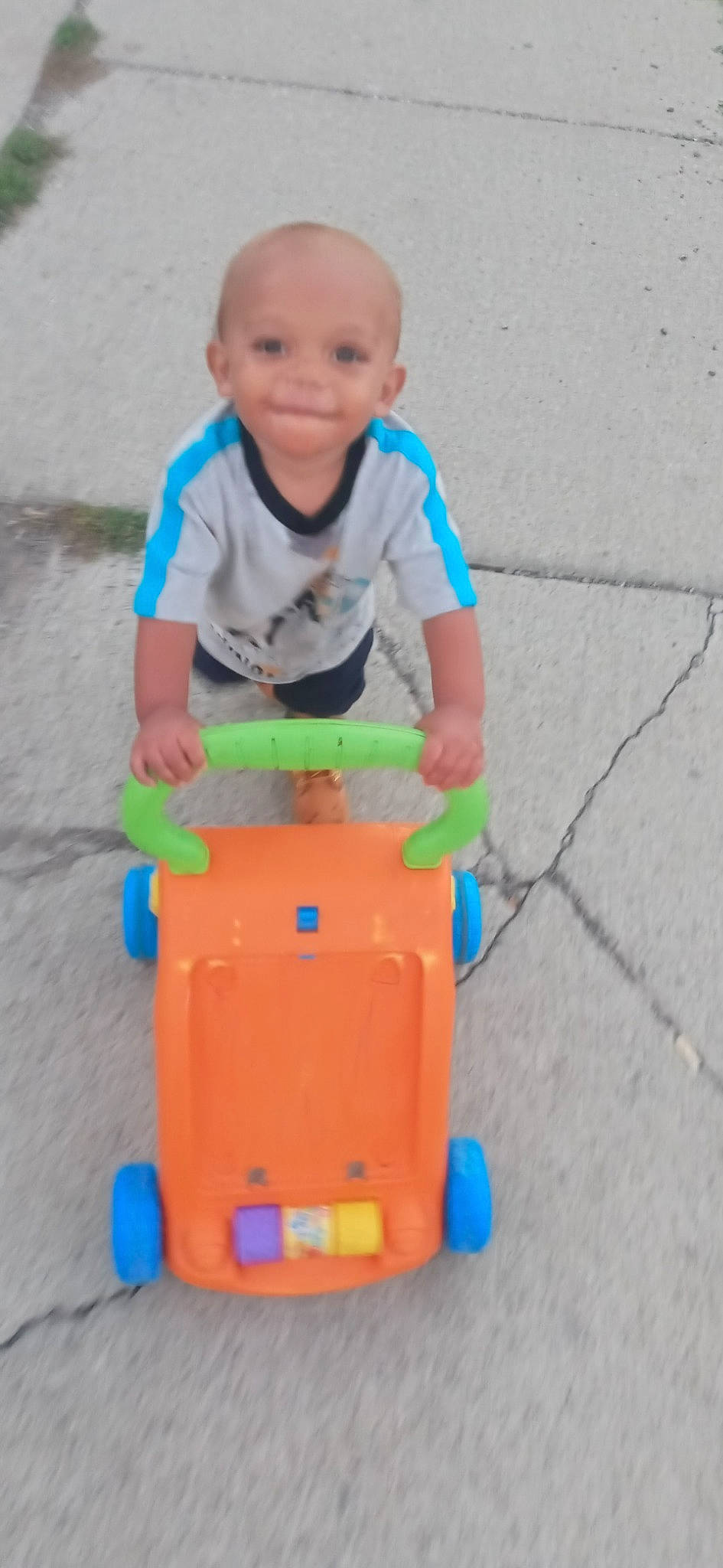 Juelz joined the competition — help win amazing prizes! baby, baby_toddler_clothing, child, electric_blue, fun, grass, happy, joy, leisure, person, plastic, play, recreation, riding_toy, rolling, sitting, smile, tire, toddler, toy