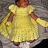 baby, newborn, sleeping, yellow_dress, crocheted_clothing, mittens, socks, infant, cute, peaceful, lying_down, fabric_background, soft, tiny, portrait, child, cozy, handmade_clothing, knit, adorable