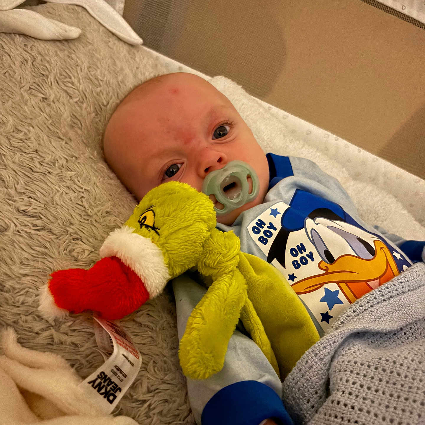 Renson joined the competition — help win amazing prizes! baby, bed, bedding, blanket, child, clothing, comfort, cute, donald_duck, indoors, infant, lying_down, pacifier, plush_toy, resting, santa_hat, sleeping_area, soft_texture, toy, wearing