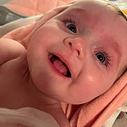 Amelia joined the competition — help win amazing prizes! baby, blanket, child, close_up, cute, expression, eyes, face, happy, indoors, infant, mouth, newborn, person, portrait, skin, smiling, soft, towel, warm