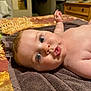 Evelyne joined the competition — help win amazing prizes! baby, infant, face, eyes, skin, towel, bedspread, indoor, expression, puckered_lips, curious, lying_down, child, person, human, closeup, portrait, cute, newborn, soft