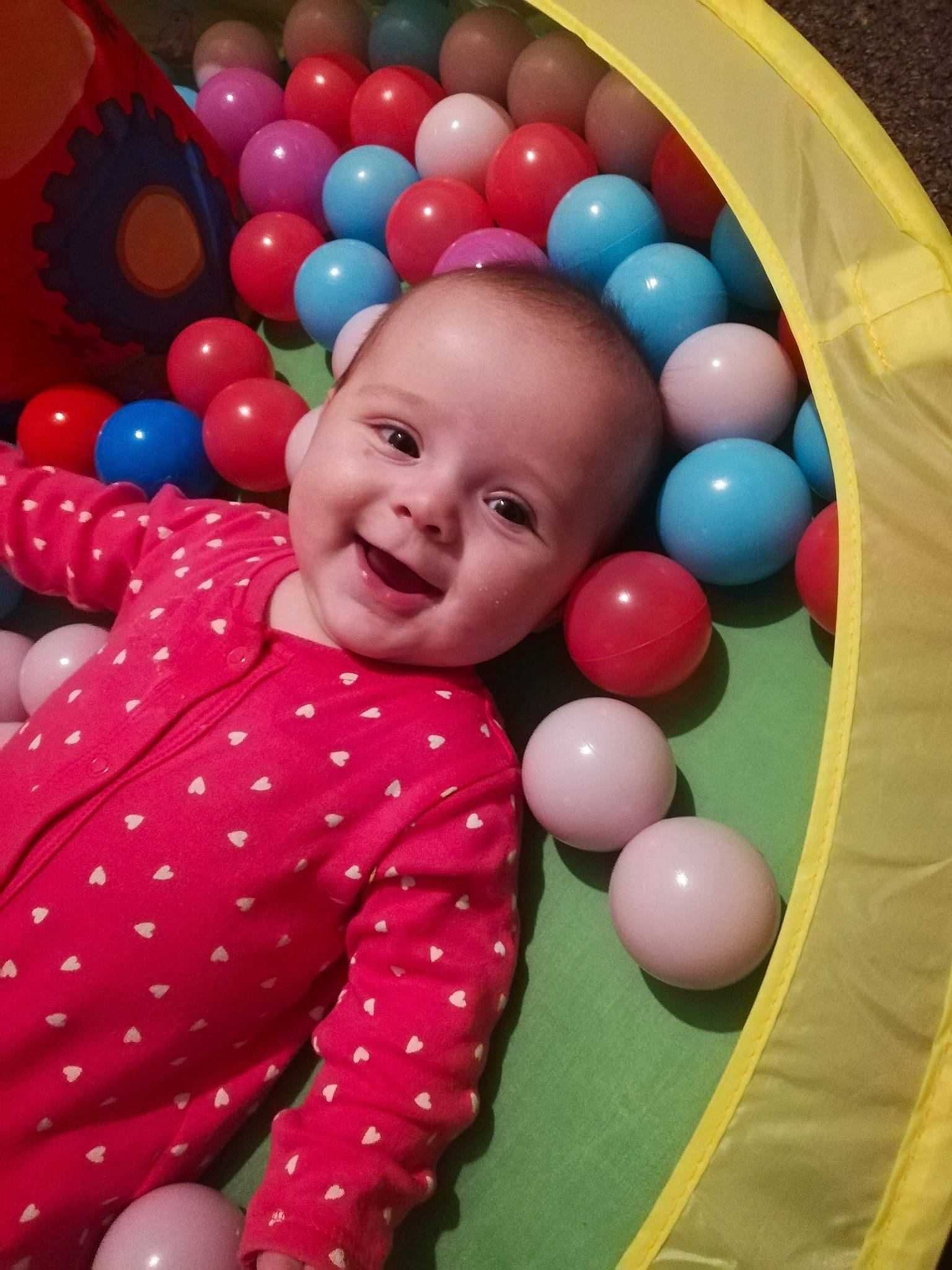 Darla joined the competition — help win amazing prizes! baby_toys, ball_pit, balloon, child, fun, person, play, smile, toddler, toy