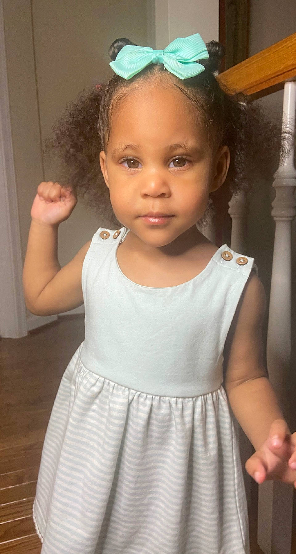 Leonnie is registered to the contest to win money with this photo: baby_toddler_clothing, black, chin, dress, eye, face, hair, hairstyle, head, human_body, joint, neck, one_piece_garment, organ, person, photograph, skin, sleeve, standing, sunglasses