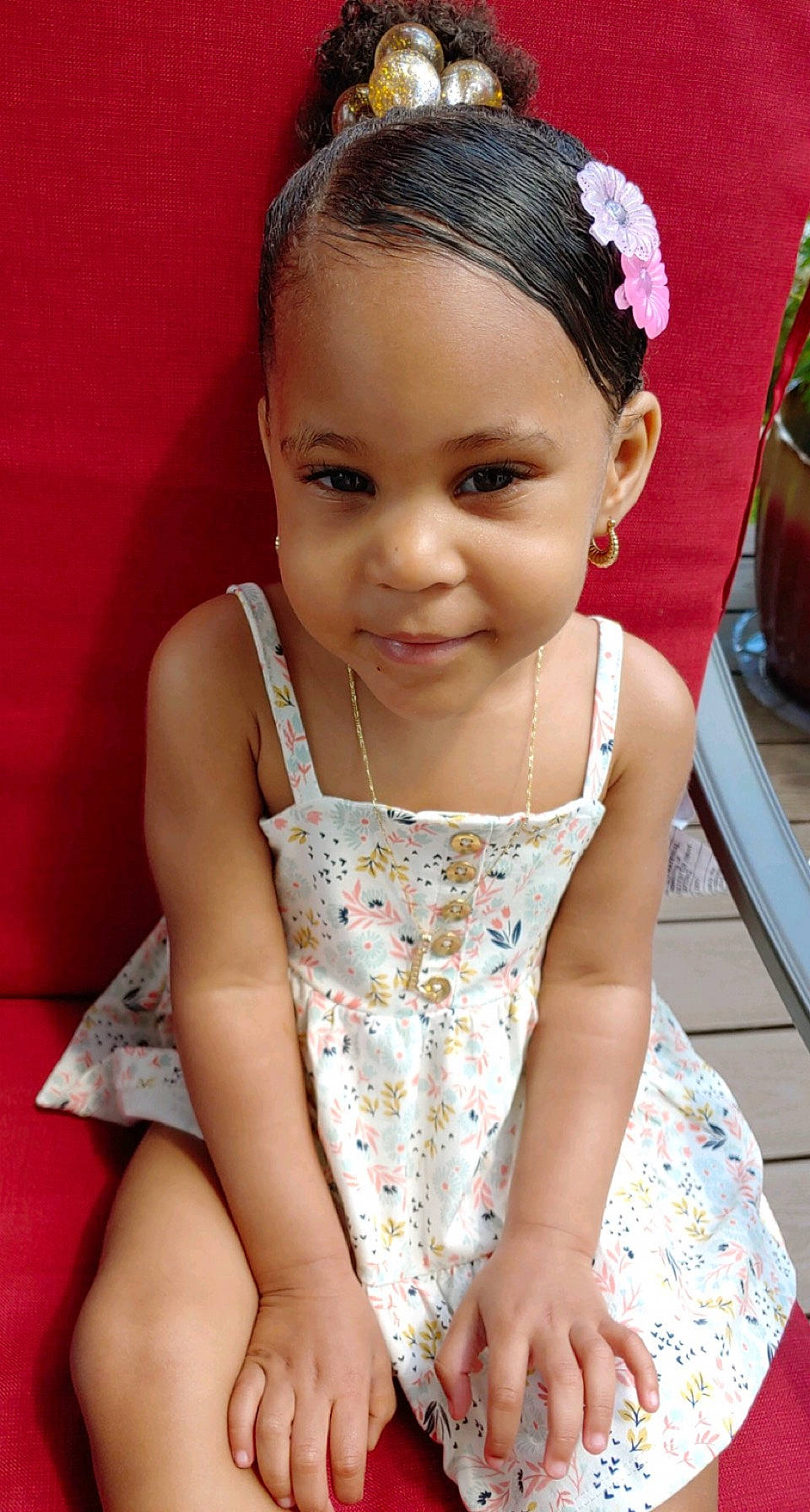 Leonnie is registered to the contest to win money with this photo: baby, baby_toddler_clothing, black_hair, cheek, chin, dress, face, flowerpot, hair, happy, head, iris, joy, lip, neck, person, pink, skin, sleeve, smile