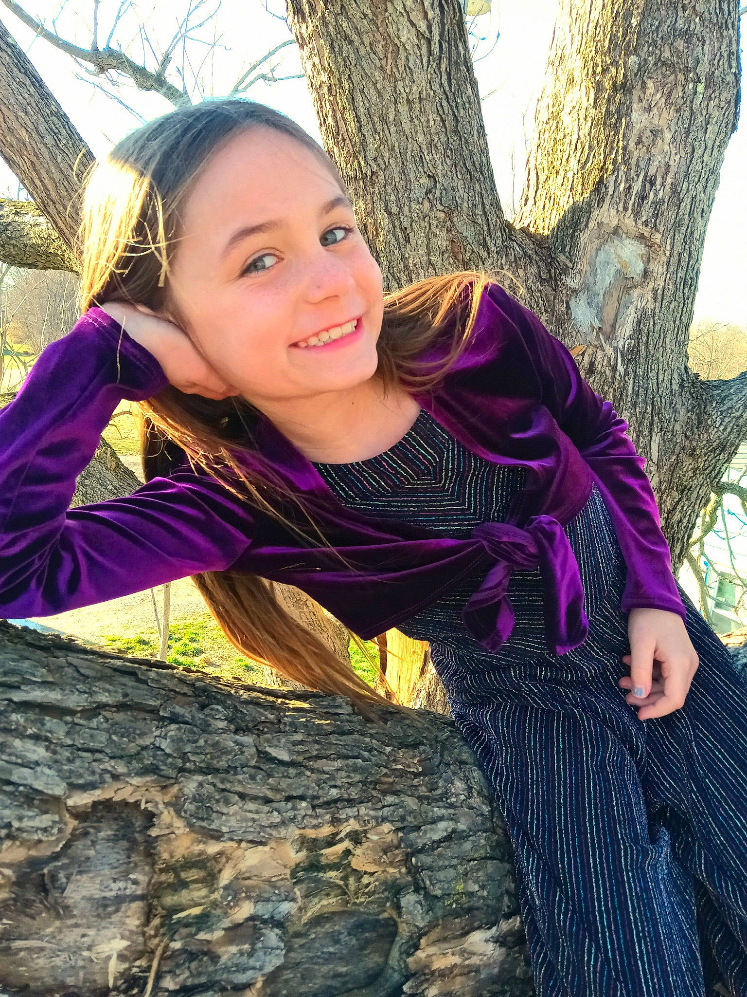 Skylah is registered to the contest to win money with this photo: cool, electric_blue, flash_photography, fun, grass, happy, head, joy, leisure, long_hair, magenta, outerwear, people_in_nature, person, plant, smile, sunlight, tree, trunk, wood