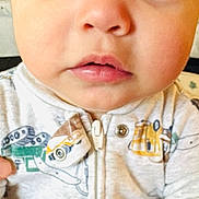 Nathan joined the competition — help win amazing prizes! baby, child, face, eyes, mouth, clothing, onesie, zipper, infant, portrait, cute, young, expression, skin, person, closeup, indoor, apparel, button, hoodie
