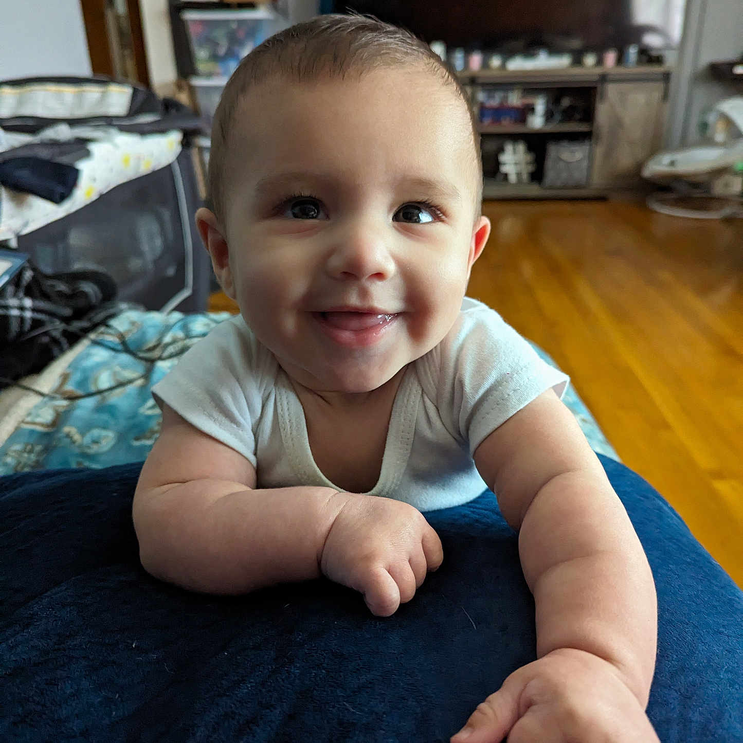 Declan joined the competition — help win amazing prizes! accessories, baby, bag, bodypart, clothing, face, finger, hand, handbag, happy, hardwood, head, pants, person, photography, portrait, shelf, sitting, smile, wood