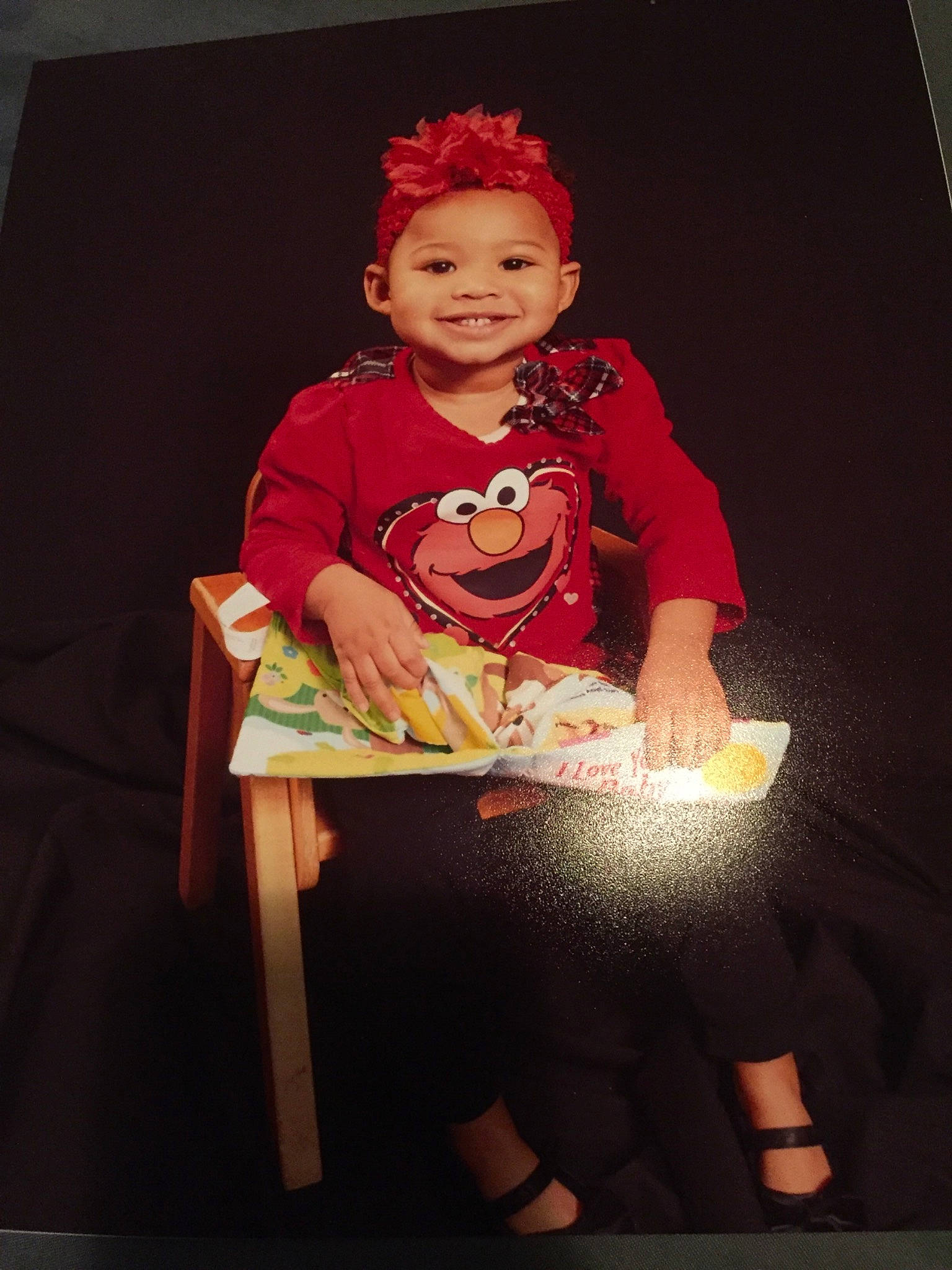 Kamara is registered to the contest to win money with this photo: child, costume, fun, joy, performance, person, sitting, smile, talent_show, toddler