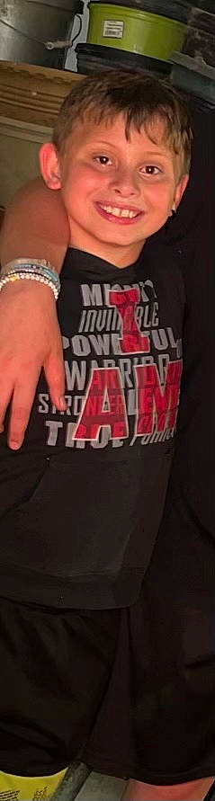 Trenton is registered to the contest to win money with this photo: active_shirt, chest, elbow, finger, font, gesture, grey, joint, joy, magenta, neck, pattern, person, shoulder, sleeve, sportswear, t_shirt, thigh, thumb, trunk