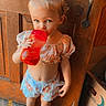 Coralyn is registered to the contest to win money with this photo: toddler, child, barefoot, red_sippy_cup, floral_clothing, wooden_floor, wooden_door, pony_tail, indoor, standing, cute, drink, box, vintage_filter, date_stamp, door_handle, light, person, young_child, casual_clothing