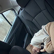 Abal joined the competition — help win amazing prizes! child, sleeping, car_interior, backseat, leather_seat, window, clothing, young, curled_up, peaceful, indoor, seat, headrest, casual, relaxed, person, transportation, travel, daytime, cozy