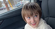 Abal joined the competition — help win amazing prizes! boy, car_interior, casual, child, clipboard, clothing, daytime, face, hair, happy, hoodie, nike_logo, pants, person, portrait, seat, seatbelt, smile, urban, window