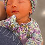 Helena joined the competition — help win amazing prizes! baby, sleeping, knitted_hat, floral_outfit, infant, close_up, peaceful, cute, person, clothing, portrait, hand, soft_lighting, warm_colors, indoor, headwear, newborn, child, cozy, holding
