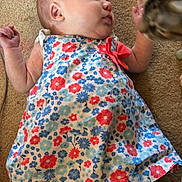 Helena joined the competition — help win amazing prizes! animal, arm, baby, carpet, cat, child, closeup, colorful, curious, dress, face, floor, floral_pattern, head, indoor, infant, interaction, leg, pet, skin