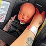 Helena joined the competition — help win amazing prizes! newborn, baby, car_seat, sleeping, infant, arm, tattoo, wristband, safety, seatbelt, child, person, closeup, indoors, cute, resting, toddler, face, skin, protection
