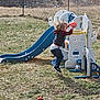 Carlisle is registered to the contest to win money with this photo: child, toddler, jumping, basketball, playground, slide, outdoor, grass, toy, playset, clothing, sneakers, fence, daylight, active, fun, sport, young, game, recreation