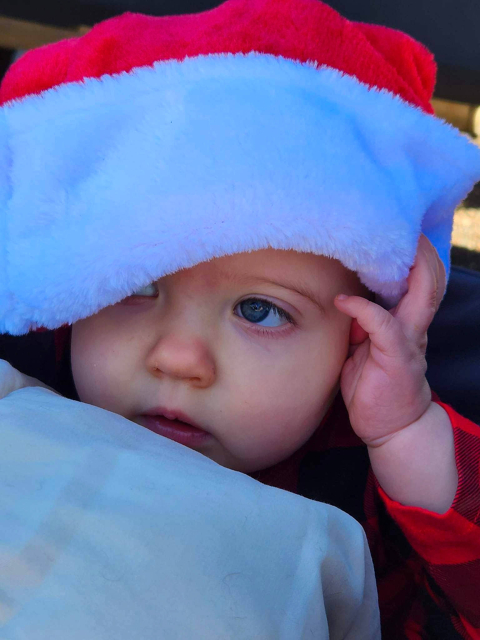 Kora is registered to the contest to win money with this photo: baby, baby_toddler_clothing, cap, child, costume_hat, electric_blue, eyelash, facial_expression, fashion_accessory, freezing, fun, fur, hat, headgear, headwear, knit_cap, outerwear, person, toddler, winter