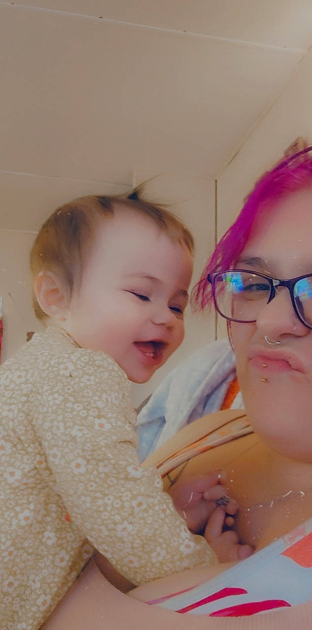 Kelly is registered to the contest to win money with this photo: baby, cheek, chin, ear, eye, eyebrow, eyelash, facial_expression, forehead, gesture, glasses, happy, iris, lip, mouth, neck, nose, person, skin, smile