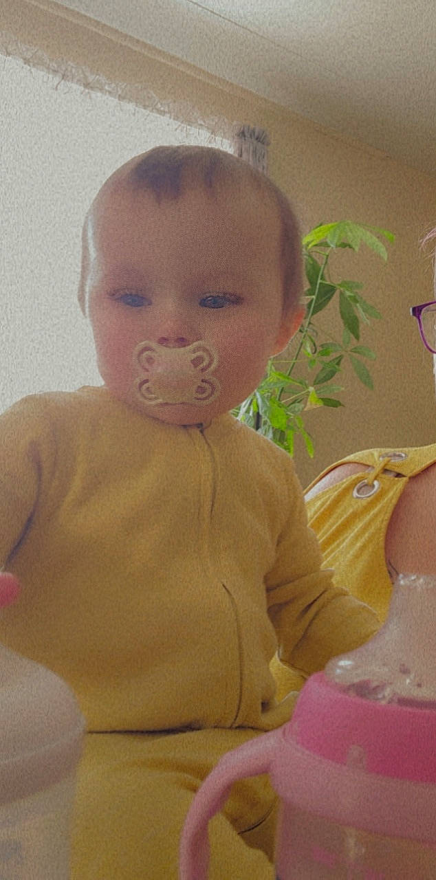 Kelly joined the competition — help win amazing prizes! abdomen, baby, baby_products, baby_toddler_clothing, bathing, cheek, chest, child, flooring, fun, happy, iris, linens, neck, nose, person, plant, room, sitting, skin