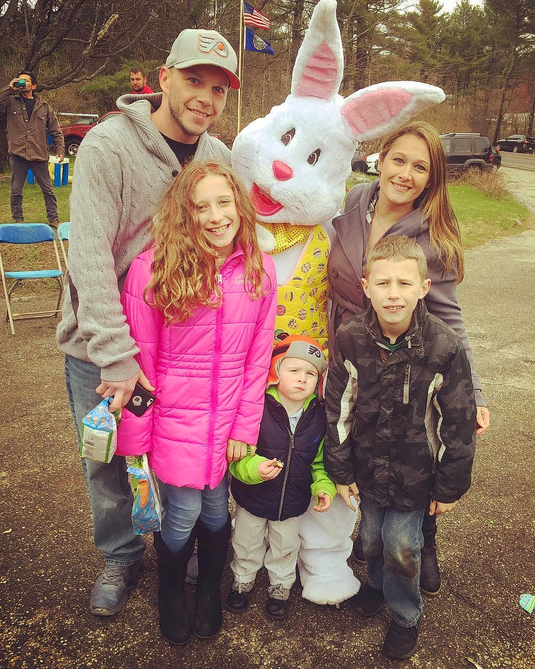 Kadence is registered to the contest to win money with this photo: clothing, community, easter_bunny, facial_expression, fun, grass, happy, head, headwear, interaction, jeans, joy, mammal, organ, person, pink, plant, rabbit, smile, textile