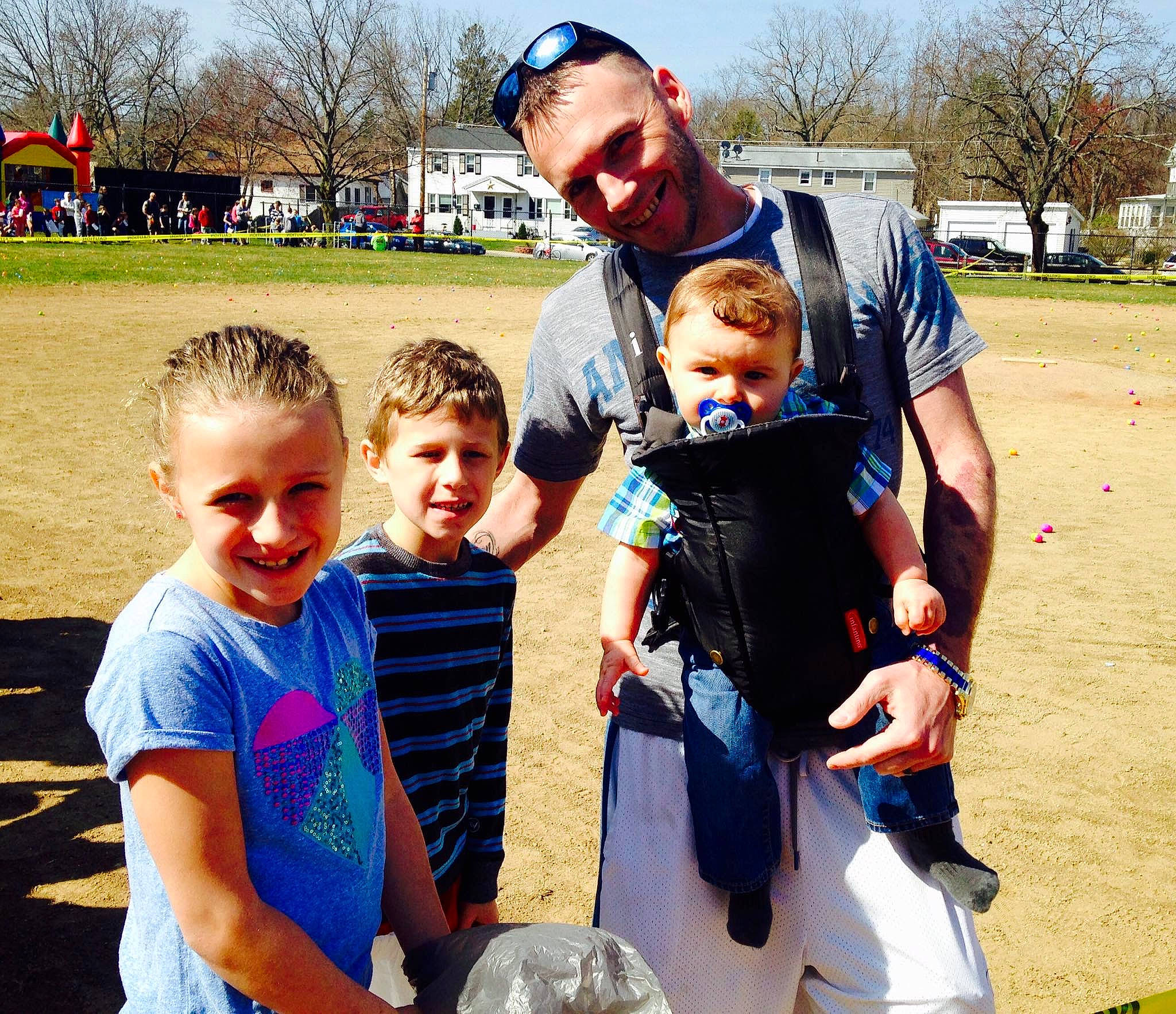 Kadence is registered to the contest to win money with this photo: child, event, face, fun, gesture, grass, happy, hat, joy, leisure, people, people_in_nature, person, personal_protective_equipment, recreation, shorts, sky, smile, t_shirt, team