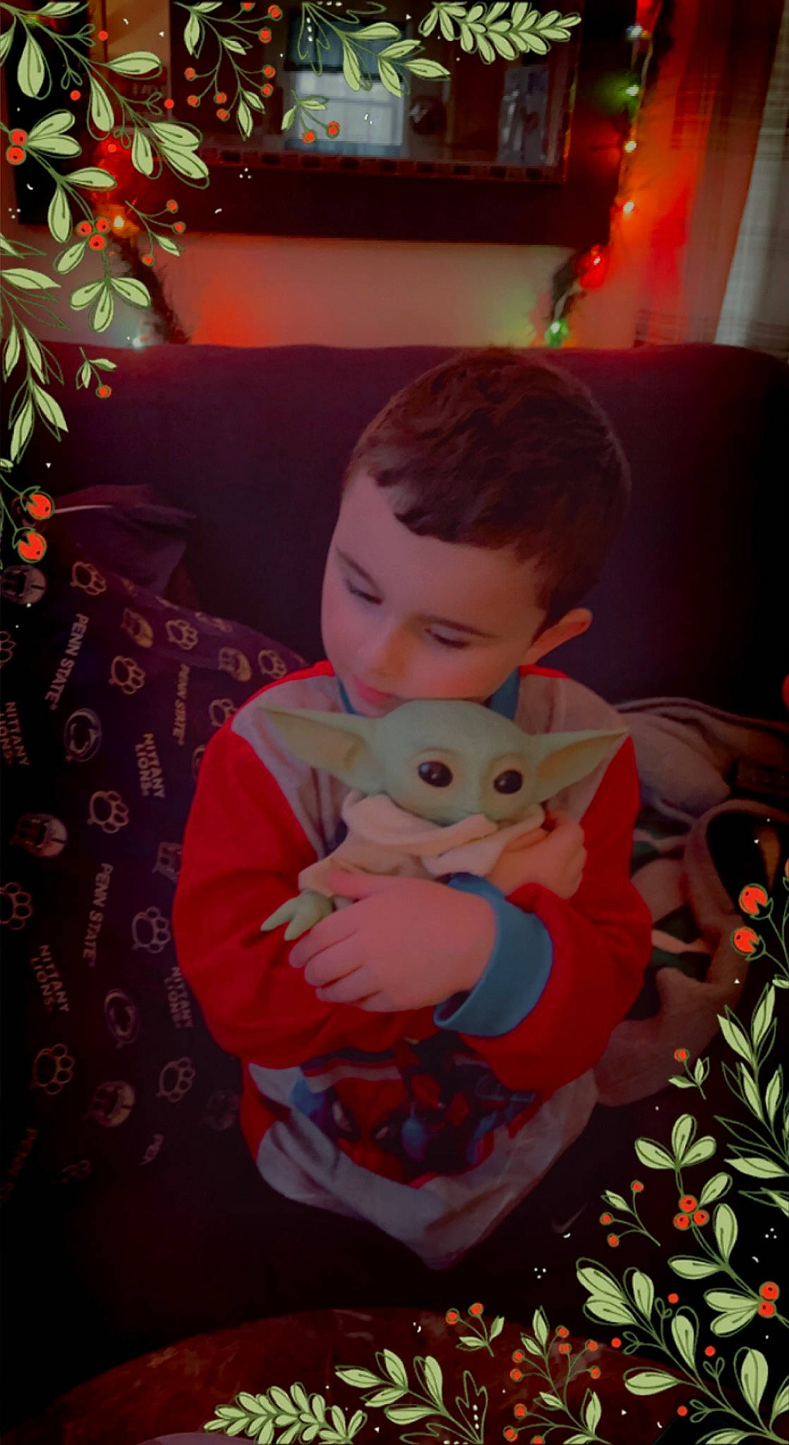 Draven joined the competition — help win amazing prizes! carmine, child, christmas, christmas_decoration, christmas_eve, christmas_ornament, christmas_tree, event, eye, fun, happy, holiday, human_body, lap, living_room, person, room, sitting, stuffed_toy, toddler