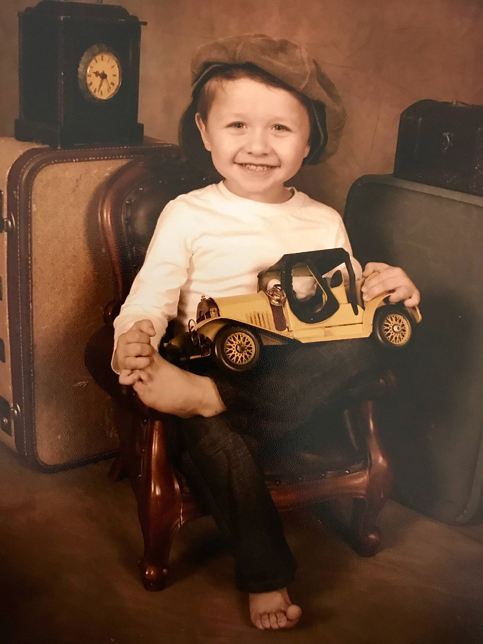 Robbie is registered to the contest to win money with this photo: camera, child, joy, person, photography, portrait, sitting, smile, toddler