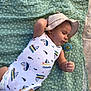 Damian a rejoint le concours — aidez-le/la à gagner de superbes lots ! baby, infant, sleeping, hat, onesie, pacifier, blanket, outdoor, sunhat, clothing, pattern, relaxing, child, cute, peaceful, lying_down, young, resting, soft, casual