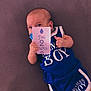 Damian a rejoint le concours — aidez-le/la à gagner de superbes lots ! baby, infant, blue_clothing, pacifier, card, text, hand, thumbs_up, face, eyes, lying_down, purple_background, cute, two_months, mamas_boy, child, person, portrait, smile, closeup