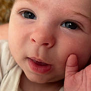 Kaysen joined the competition — help win amazing prizes! baby, closeup, face, hand, skin, eyes, infant, child, portrait, cute, soft, expression, fingers, young, human, looking, indoors, cozy, person, childhood