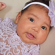 Elizabeth is registered to the contest to win money with this photo: baby, infant, face, headband, flower, smile, eyes, lace, clothing, purple, cute, portrait, child, skin, adorable, young, person, closeup, happy, baby_girl