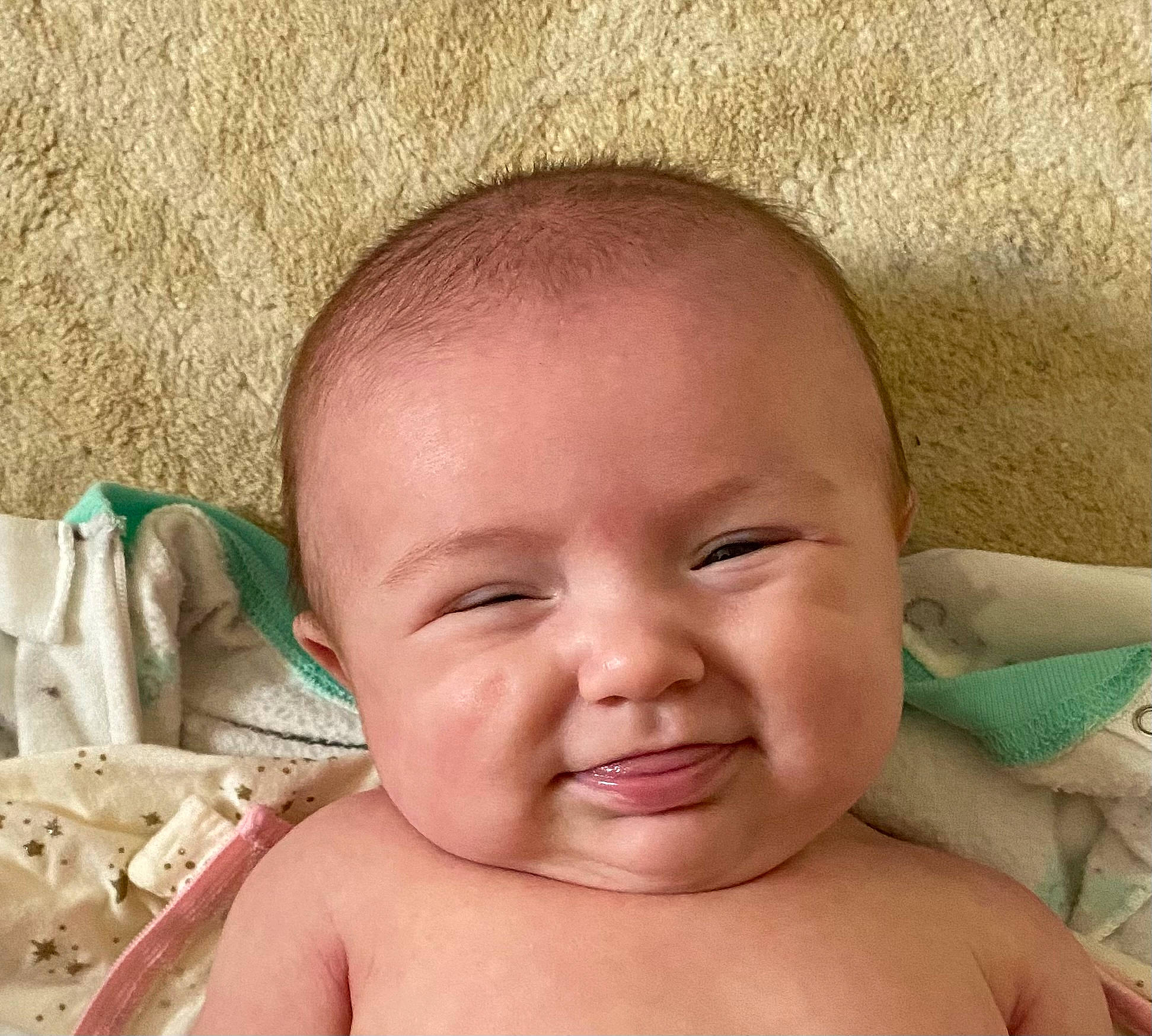 Keira is registered to the contest to win money with this photo: arm, baby, cheek, ear, eye, eyebrow, eyelash, forehead, hair, hand, happy, head, human_body, jaw, lip, mouth, neck, nose, person, skin