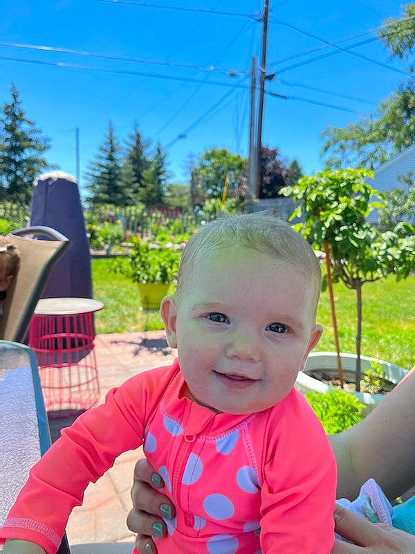 Mckenzie joined the competition — help win amazing prizes! baby, baby_toddler_clothing, blue, chair, child, fun, grass, happy, human_settlement, leaf, leisure, outdoor_play_equipment, person, plant, public_space, recreation, sitting, sky, smile, toddler