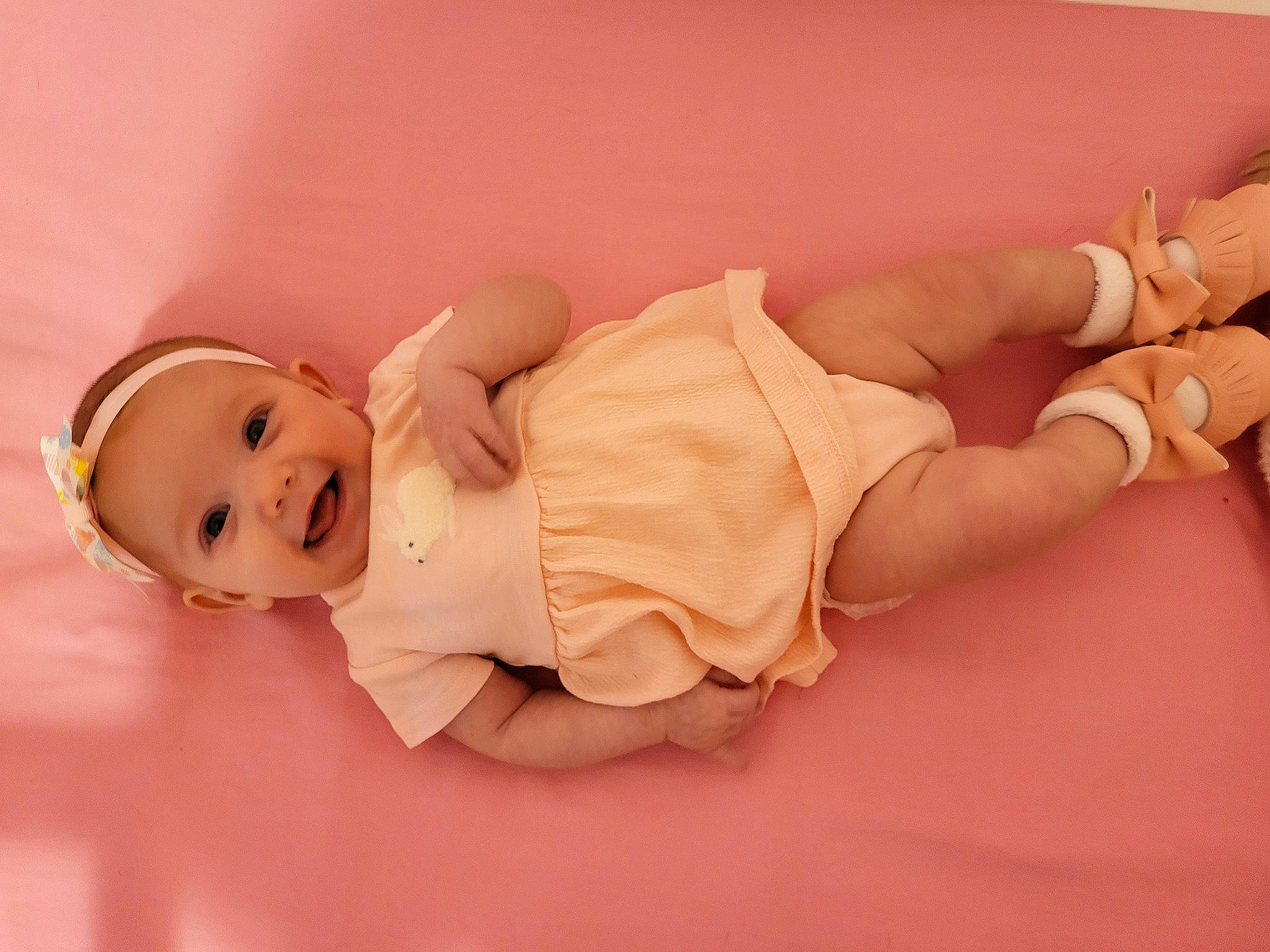 Mckenzie is registered to the contest to win money with this photo: baby, baby_toddler_clothing, barefoot, child, comfort, eye, flooring, foot, fun, happy, human_body, human_leg, knee, leg, person, skin, smile, thigh, toddler, wood