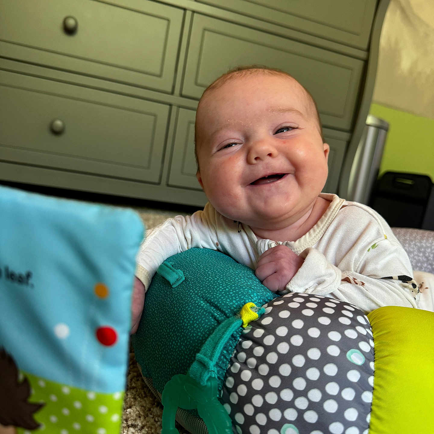 Maeve joined the competition — help win amazing prizes! americanfootball, americanfootballball, baby, ball, cabinet, closet, couch, cushion, drawer, face, football, furniture, happy, head, homedecor, person, photography, pillow, portrait, sport