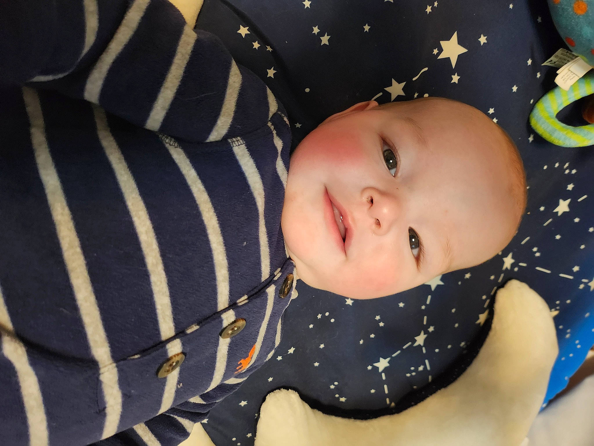 Joey is registered to the contest to win money with this photo: baby, baby_products, baby_toddler_clothing, cheek, child, comfort, eye, fun, happy, head, iris, pattern, person, portrait_photography, sitting, skin, sleeve, smile, toddler