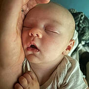 Atillia is registered to the contest to win money with this photo: baby, sleeping, hand, infant, closeup, peaceful, face, skin, clothing, person, newborn, soft_light, cozy, resting, portrait, toddler, cute, human, gentle, comfort