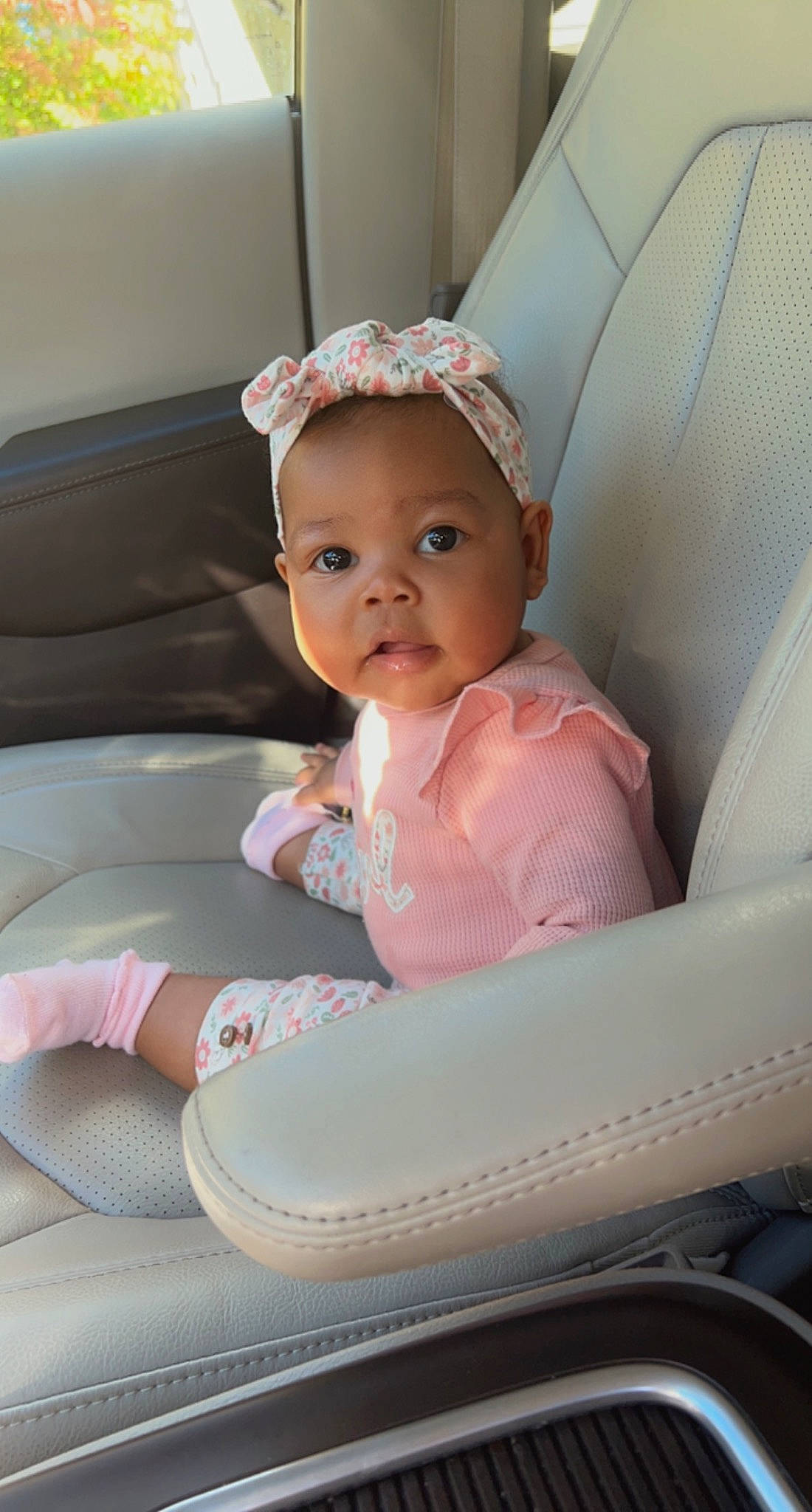 Harmony is registered to the contest to win money with this photo: auto_part, baby, baby_products, baby_toddler_clothing, car_seat, chair, cheek, child, comfort, fashion_accessory, foot, happy, human_leg, jewellery, person, pink, sitting, skin, sock, toddler